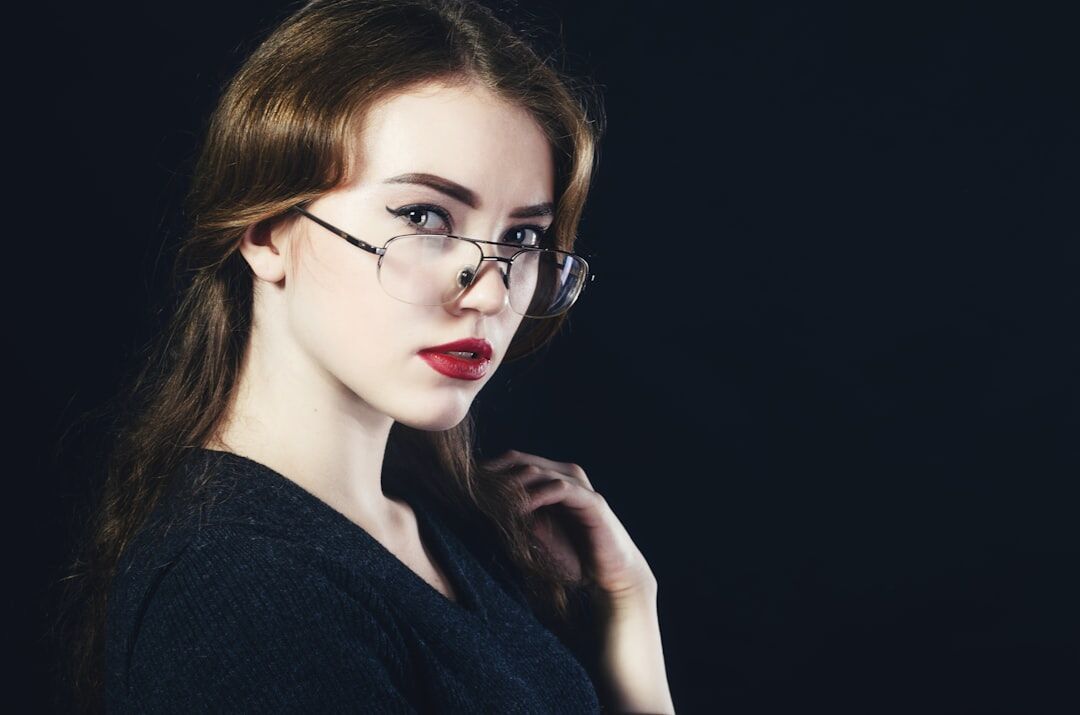 Studio portrait of a young professional woman with glasses