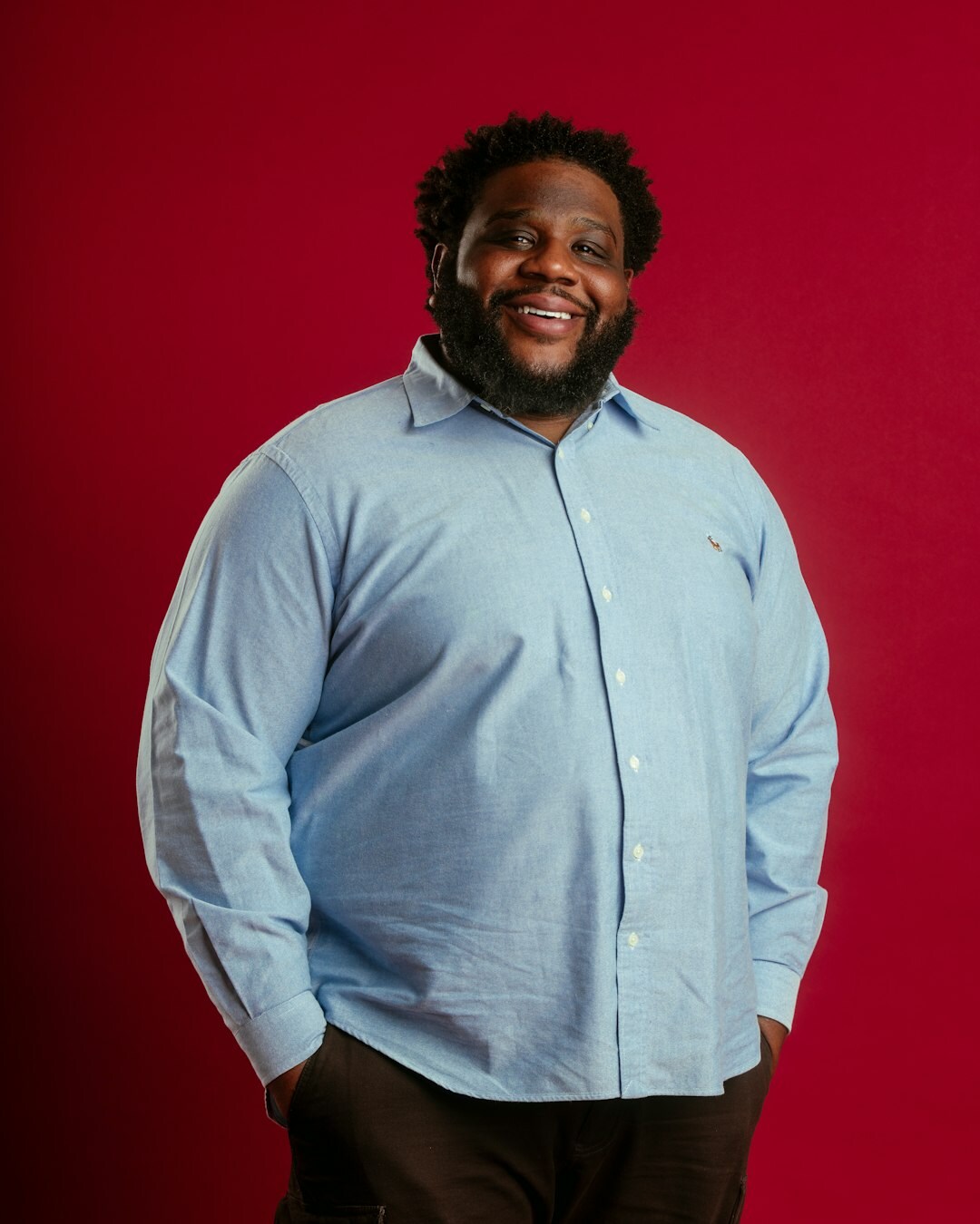 Studio portrait of a smiling businessman in a shirt